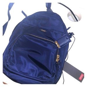 TUMI navy blue one-shoulder travel backpack